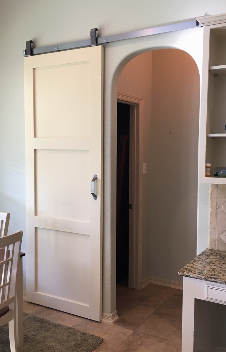 Quaker style barn door in Miami kitchen.